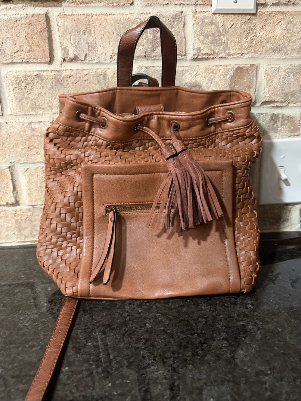 Altar'd State Woven Leather Tassel Backpack in Brown